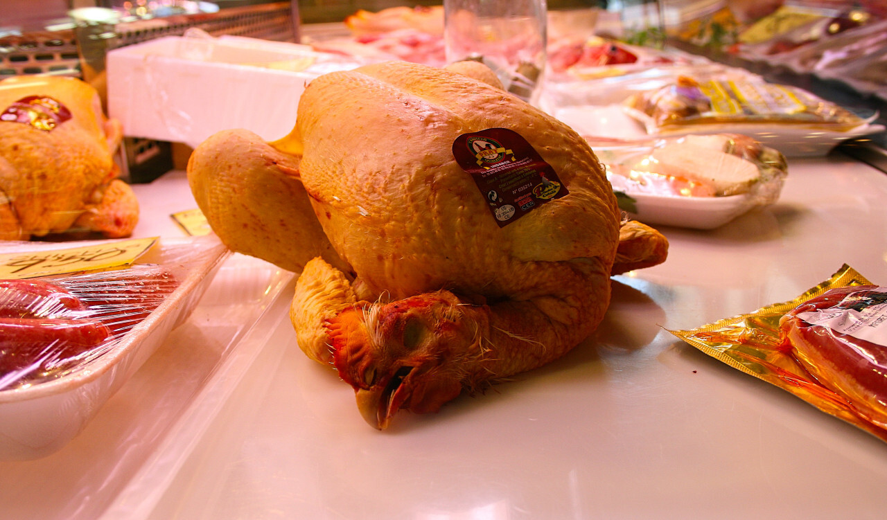 cooked whole chicken with head