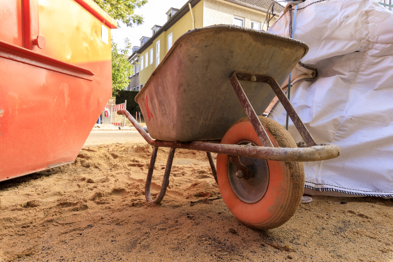 Old wheelbarrow on a construction site