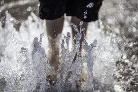 Stock Image: Child cools off in water in summer