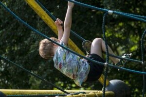 child on jungle gym