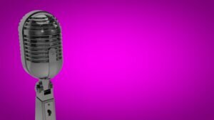 silver microphone on pink background